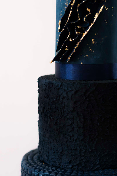 Deep blue 3 tier modern textured wedding cake made in Manchester, England.