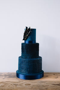 Great value contemorary navy blue textured three tier wedding cake with abstract voile edged in edible gold leaf